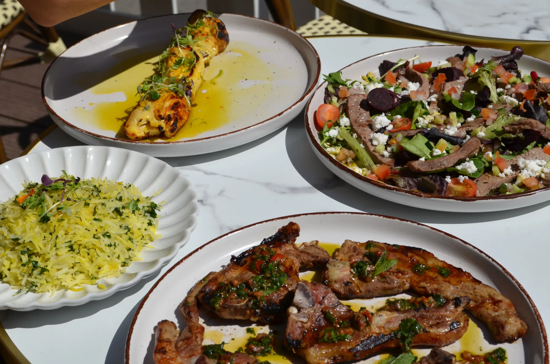 Lamb chops with saffron rice and salad spread